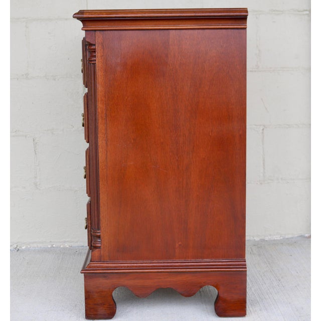 Elevate your space with this exquisitely crafted traditional bachelor's chest/bedside nightstand by renowned American...