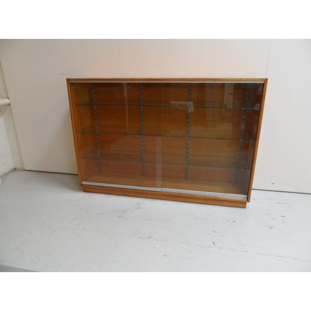 Vintage Shop Display Bookcase with Sliding Doors, 1950s, in Very Good conditions. Designed 1950 to 1959