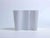 Vintage white jacketed glass vase designed by Alvar Aalto and realized by Iittala, Finland. Realized since 1960s, this...