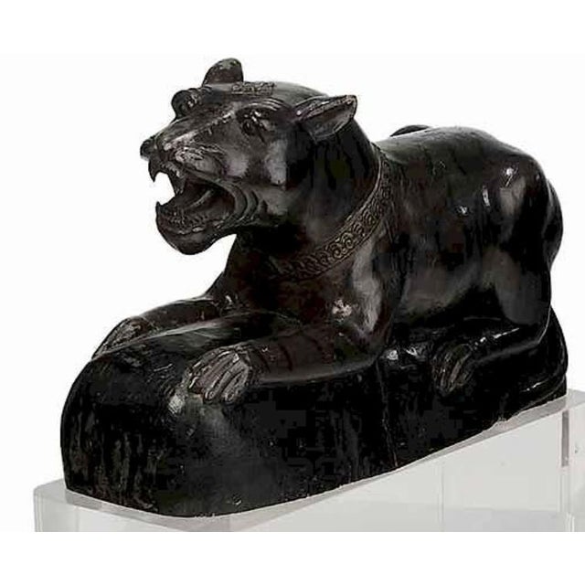 Jaguar Figures Resting on Heavy Lucite Bases probably early 20th century, each depicting a crouching and snarling jaguar,...