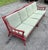 A fabulous vintage 2-piece bamboo and rattan sectional sofa with older red paint, showing nice age and patina. Includes...