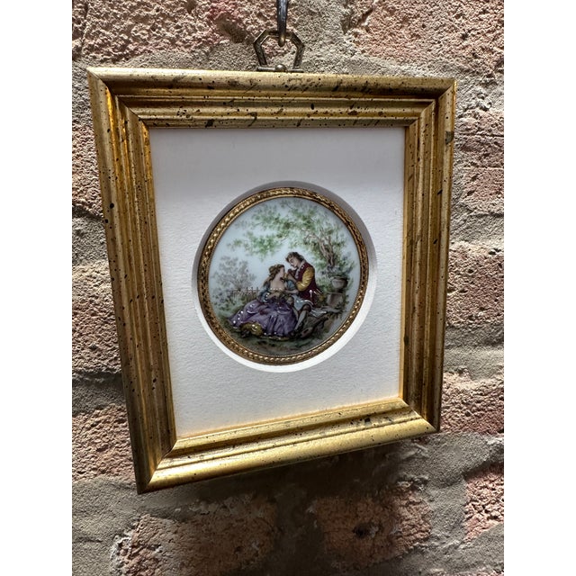 Vintage French porcelain plaque with hand painted scene of romantic couple in a garden setting, signed Fragonard, French...