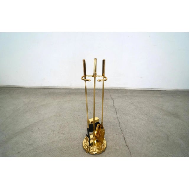 Vintage 1960's Mid century Modern fireplace tool set for sale. Comes with the brass stand and three tools. It comes with...