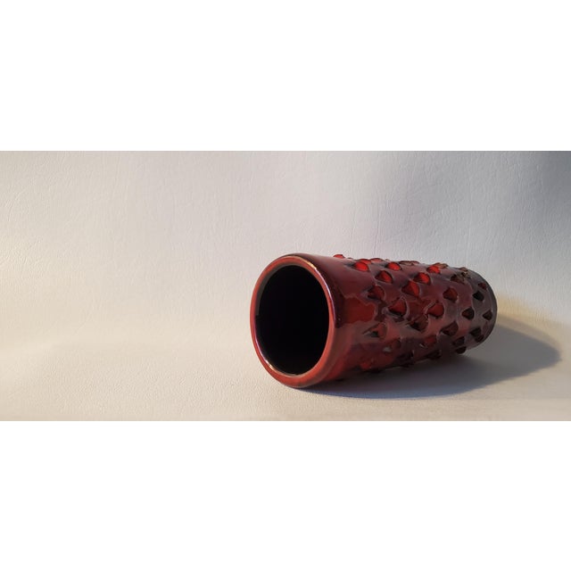 Romantic Italian made strawberry red ceramic vase attributed to Fanciullacci for Bitossi. A deep red ceramic glaze graces...