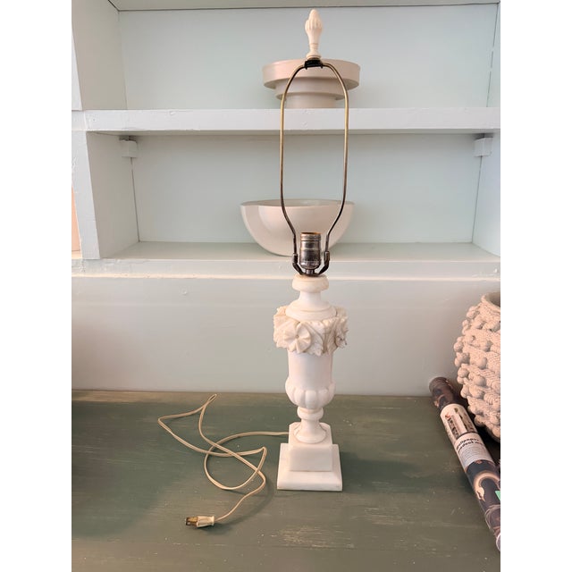 Beautiful vintage alabaster table lamp featuring an elegant neoclassical urn form with hand-carved floral and leaf...