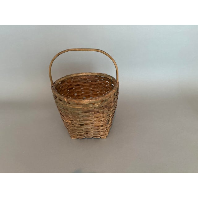 Primitive antique woven basket is 8 inches round at the opening and 5 inches at the base and 7 inches high. Even though it...