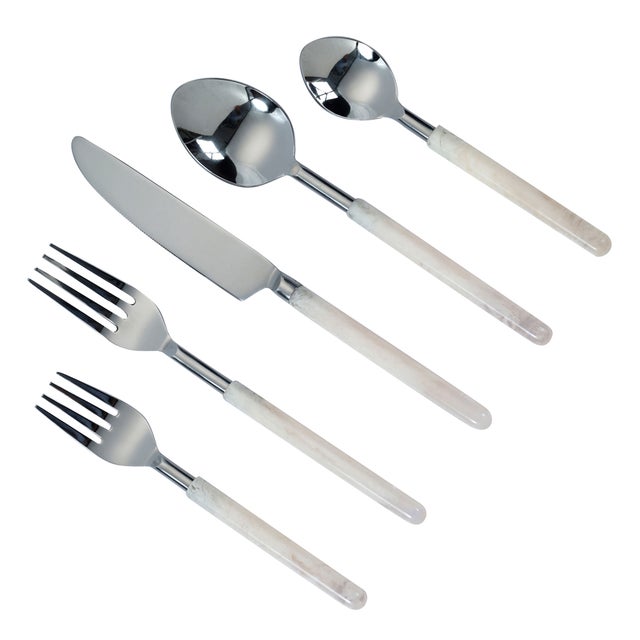 Lustrous stainless steel pairs with pearly frosted handles in this five-piece flatware set, complete place setting. With...