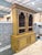 Vintage farmhouse hutch cabinet with a two piece construction featuring an upper display cabinet and lower storage base....