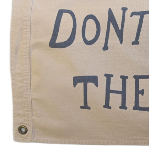 Custom-tailored all-cotton canvas nautical beachy flag that reads "DON'T GIVE UP THE SHIP" in tan with navy blue...