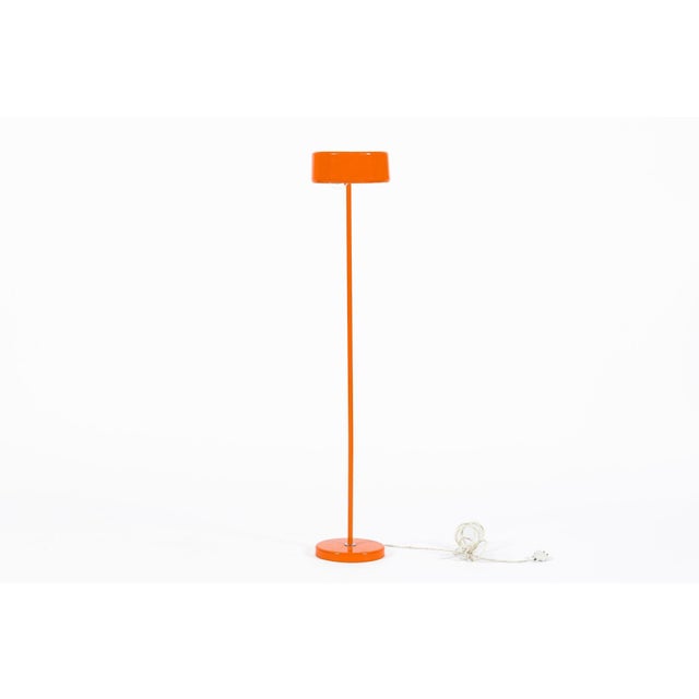 This vintage mid century Swedish modern orange floor lamp designed by Anders Pehrson for Ateljé Lyktan was made in Sweden...