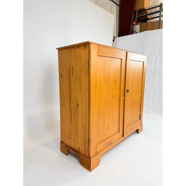This is a beautiful 19th century housekeeper’s cupboard crafted in warm honey toned pine. Its simple paneled doors, clean...