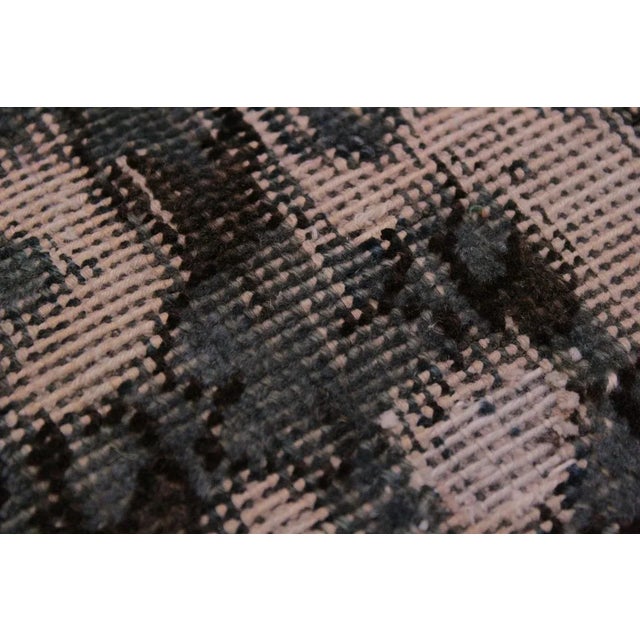 A mesmerizing addition to any décor, this brand-new hand knotted vintage distressed wool rug featuring vibrant colors and...