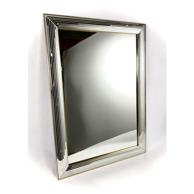 Vintage mirror by the Belgian producer Deknudt from the 1980s in Hollywood Regency style. Beautiful mirror with a glass...