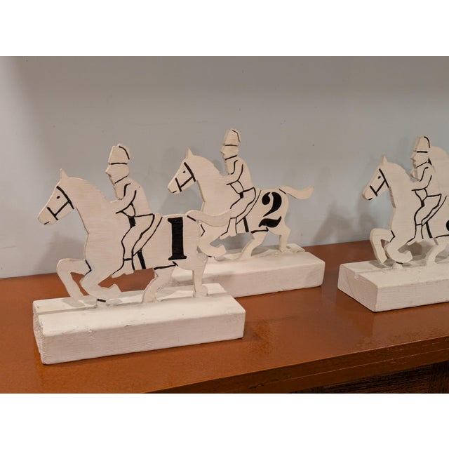 Vintage wood cut race horse sculptures numbered from 1 to 6. Each horse is mounted on a 2"x 4" set into a groove. Each...