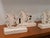 Vintage wood cut race horse sculptures numbered from 1 to 6. Each horse is mounted on a 2"x 4" set into a groove. Each...