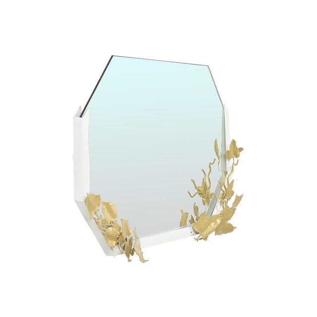 Octagonal mirror with carved brass decorations signed Henri Fernandez. This piece is designed in the style of the selected...