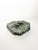 French green marble ashtray dating from the 1950s. Carved from a solid piece of richly veined stone, it features an...