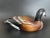 A Mid-Century large wood Canada goose decoy. Hand carved and hand painted with nice details. Glass eyes. Unmarked. Good...
