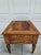A classic Henredon side table with two drawers and a banded top surrounding book matched walnut veneers. This table has...