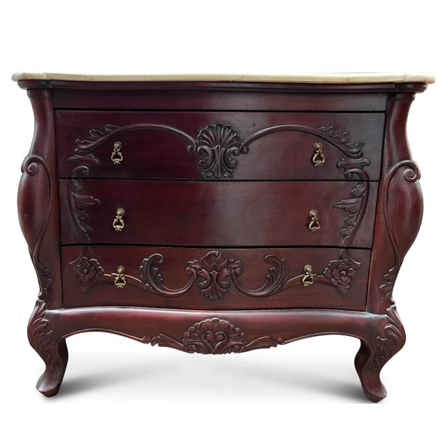 The beautiful, rich burgundy tones and carved detailing contrast wonderfully with the fresh, smooth travertine top and...