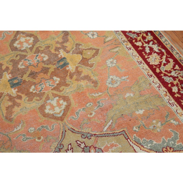 Marvelous early 20th century antique Indian Agra rug with a canteloupe color field and deep red border, accents in gold,...