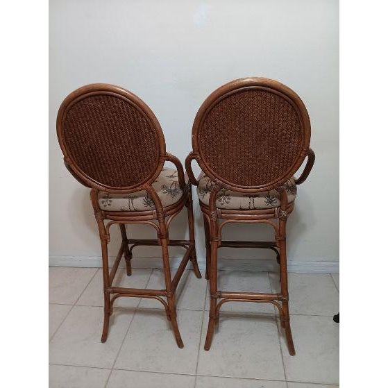 Add a touch of sophistication to your home bar with this set of four Tommy Bahama style barstools. The upholstered seat...