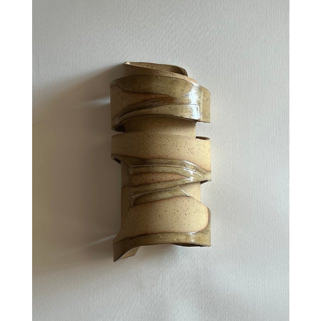 *motion* is a sculptural wall light that explores the continuous, evolving movement of the earth. Inspired by geological...