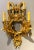 Pair of four-light Louis XVI style bird and face mounted gilt bronze wall sconces. This newly wired and restored pair of...
