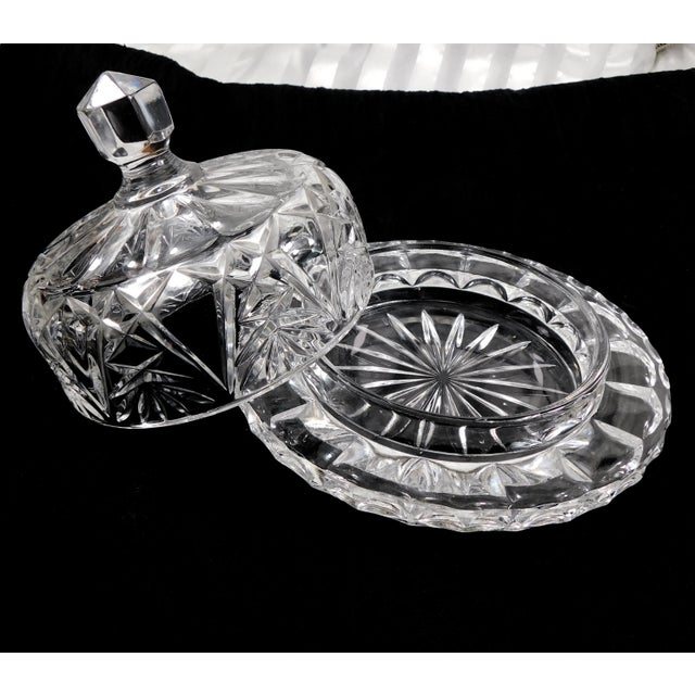 This is a heavy cut glass serving dish for cheese or butter with a matching lid. The two pieces fit together perfectly....