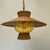 Gorgeous and rare Mid-Century Pendant Lamp, made of woven wicker with yellow "crinkle" glass. Beautiful and understated...