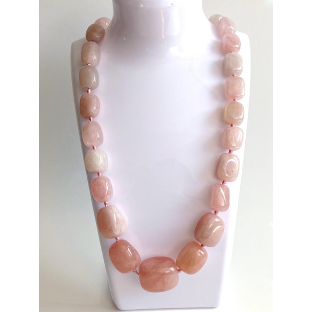 This bold, luxurious rose quartz necklace is a true statement piece, handcrafted with oversized, beautifully polished rose...