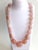 This bold, luxurious rose quartz necklace is a true statement piece, handcrafted with oversized, beautifully polished rose...
