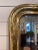 This is a gorgeous 19th Century Louis Philippe mirror! The mirror features a beautiful champagne floral etched design...