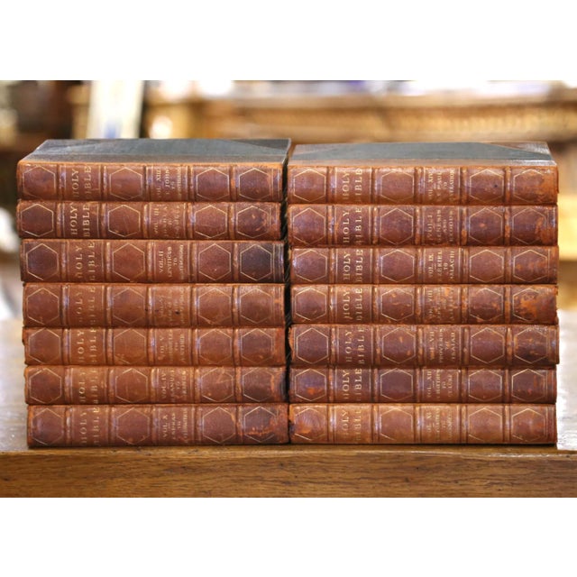 A complete 14-volume edition of The Holy Bible, this finely bound antique set was published in London by The Grolier...