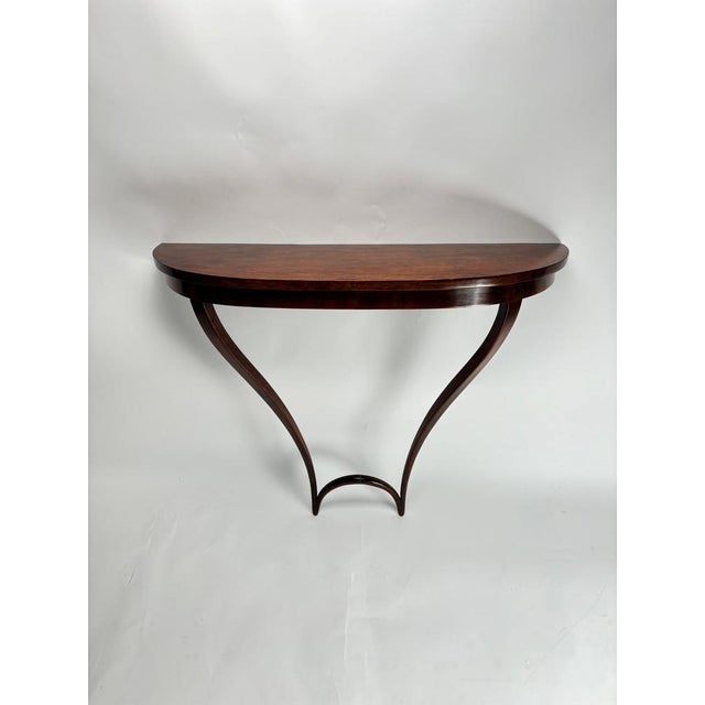 Rare and elegant mid-century Italian wooden console table attributed to the Italian architect and designer Carlo Emilio...