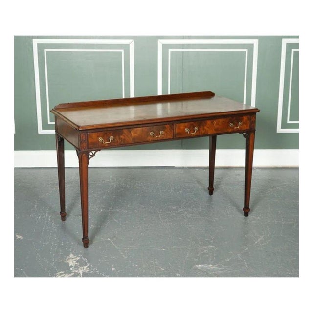 Lovely Chippendale-style Console hallway table. It serves two drawers with two handles on each drawer. The handles are...