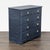 This dresser features a navy blue finish and five spacious drawers, perfect for organizing clothes and essentials. The...
