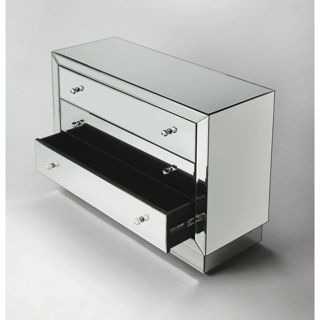 Dressed in true urban sophistication, this dresser is sheathed in mirror, even the deep, platform base. Handcrafted...