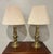 Classic pair of Stiffel brass candlestick-style table lamps with tiered column bases and original cream pleated fabric...