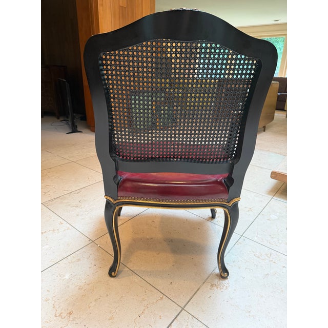 An elegant mid-20th-century Louis XV–style armchair by John Widdicomb Co. of Grand Rapids, Michigan, retaining its...