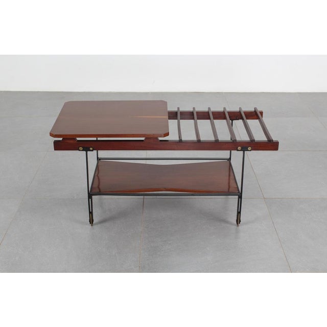 Beautiful coffee table with a geometric black lacquered metal frame and teak tops. Made in Italy, attributed to HOME...