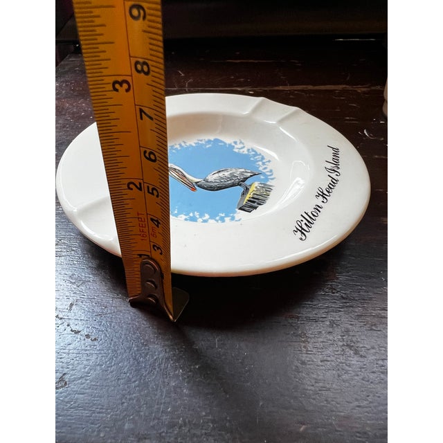 Up for consideration is a beautiful vintage small ceramic Hilton head ashtray with a pelican design. This would look...