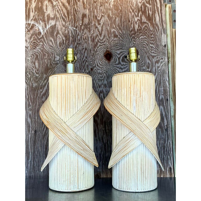 Elevate your interior with this stunning pair of vintage coastal-inspired pencil reed lamps. Featuring a beautifully...