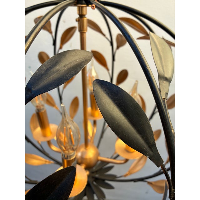 Beautifully crafted metal fixture with a georgeous black and gold finish.16x183/4" diameters and weighs 6 pounds. It came...