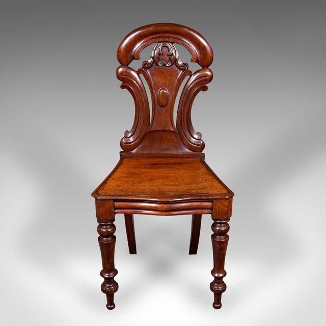 This is an antique hall chair. A Scottish, walnut occasional reception seat, dating to the Regency period, circa 1820....