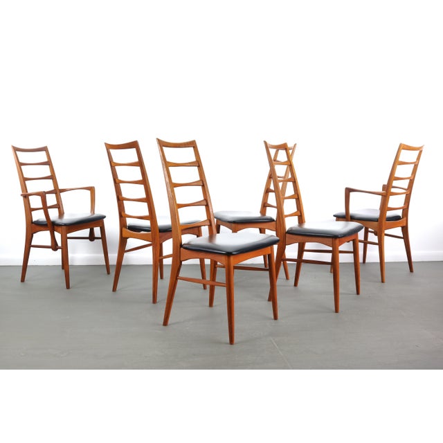 Stunning set of six ( 6 ) vintage modern dining chairs feature unique ladder back rests and upholstered seats. Sleek...