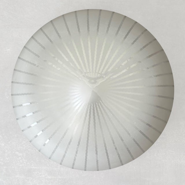 A modernist flush-mount ceiling fixture, model 11619, designed by Harald Notini for the Swedish manufacturer Arvid...
