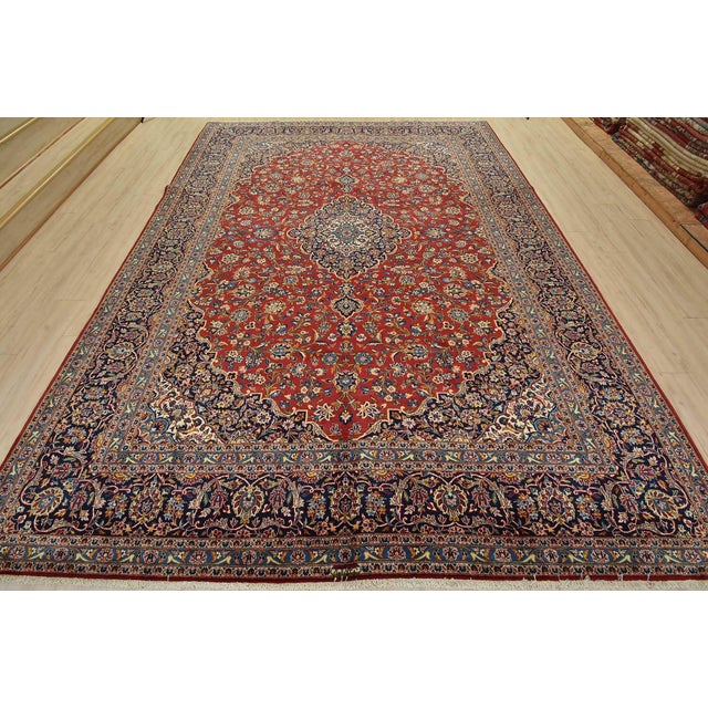 An authentic vintage traditional Kashan rug hand-knotted with fine wool and natural dyes. This oriental rug features a...