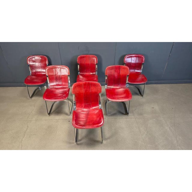 Set of 6 dining chairs manufactured by Cidue. The chairs have a beautifully shaped chrome frame and come with the original...