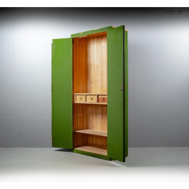 The cabinet is old and has the great old wood flair with the green color from the early 20th century, 1920s. The division...